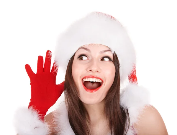圣诞老人帽子用手靠近耳朵的女孩听着. — 图库照片