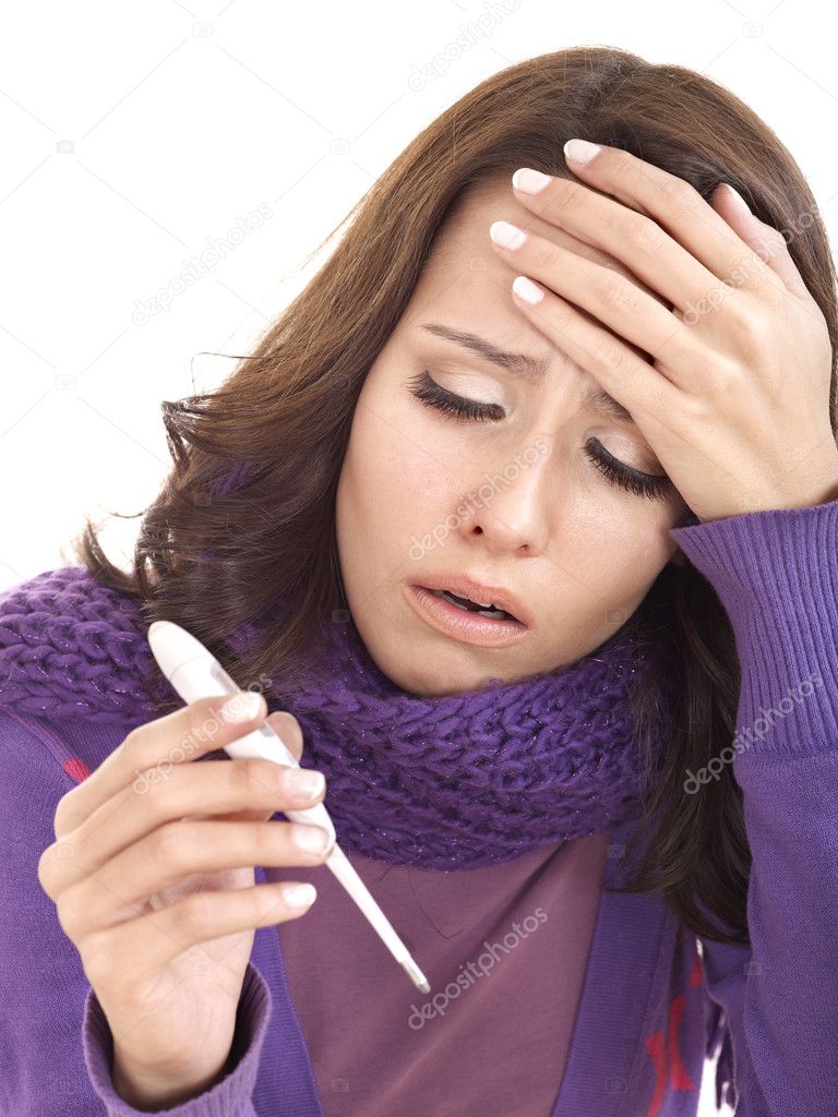 Young woman having flue taking thermometer.