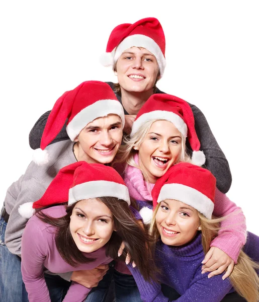 Noel Baba şapkası içinde genç grup — Stok fotoğraf