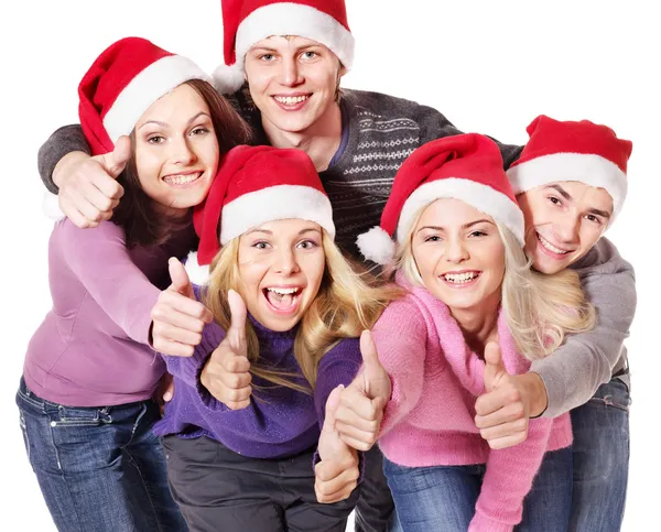 Група молодих у капелюсі Санта показувати великі пальці вгору . — стокове фото