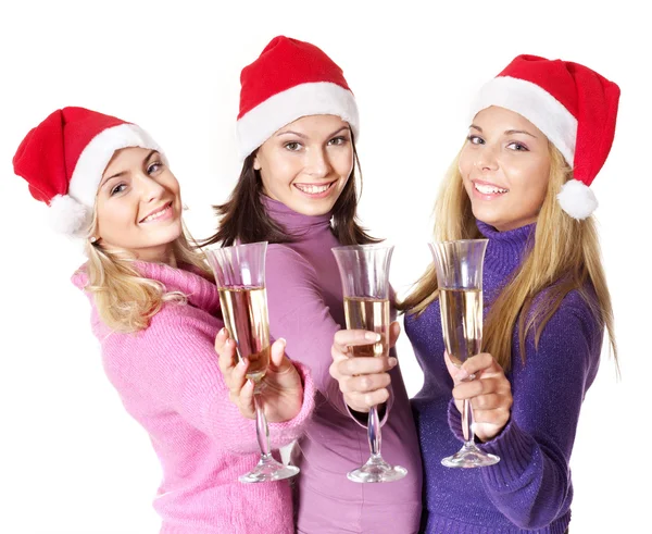 Девушки в шляпе Санты пьют шампанское — стоковое фото