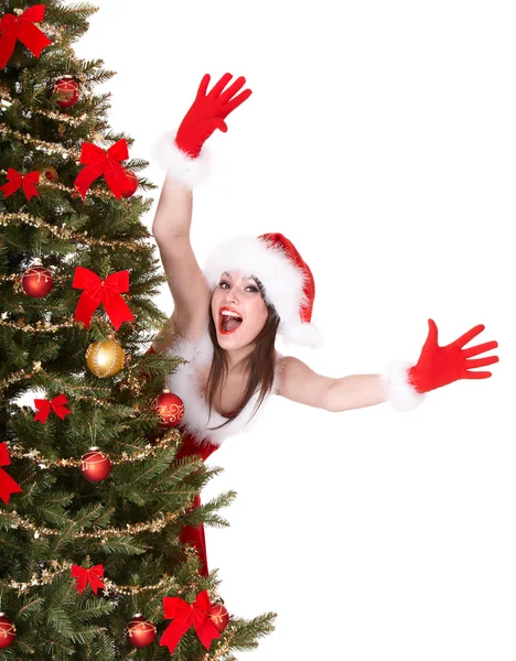 Різдвяна дівчина в капелюсі Санта біля дерева рука вгору . — стокове фото