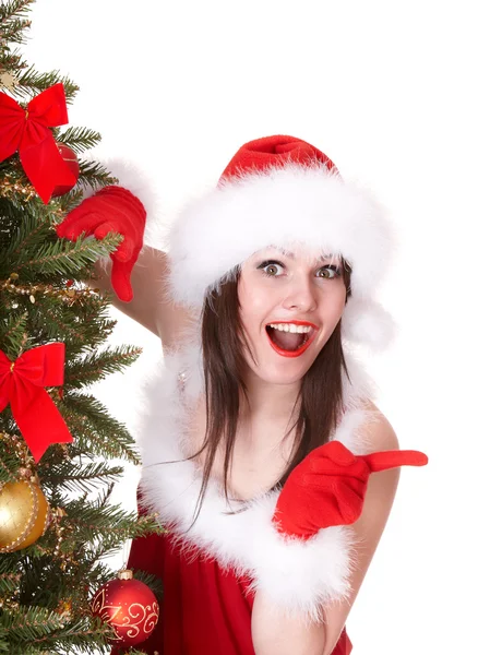 Menina de Natal em Santa hat point, abeto . — Fotografia de Stock