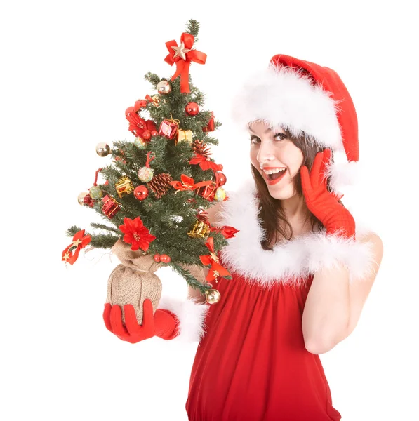 Meisje in Kerstman hoed, bedrijf kerstboom. — Stockfoto