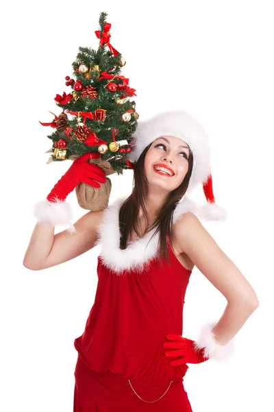 Noel ağacı holding Noel Baba şapkalı kız. — Stok fotoğraf