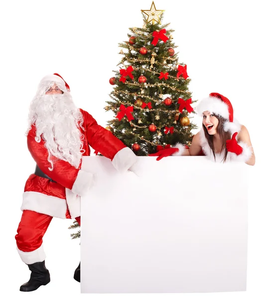Papai Noel e menina por árvore de natal e caixa de presente . — Fotografia de Stock
