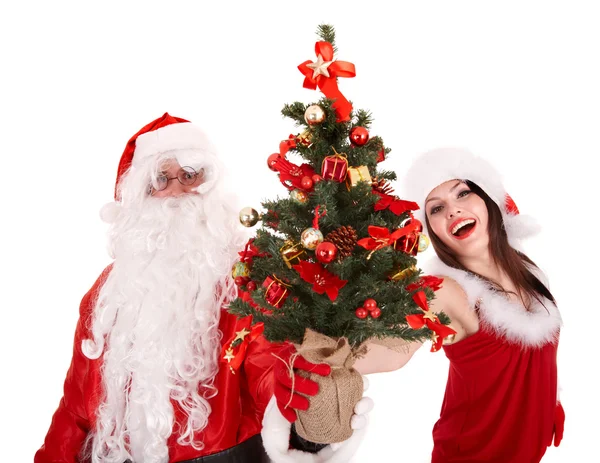 Santa clausule en Kerstmis meisje met boom. — Stockfoto