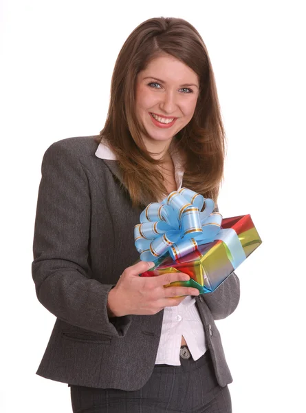 Young businesswoman with gift bag. Isolated. — Stock Photo, Image