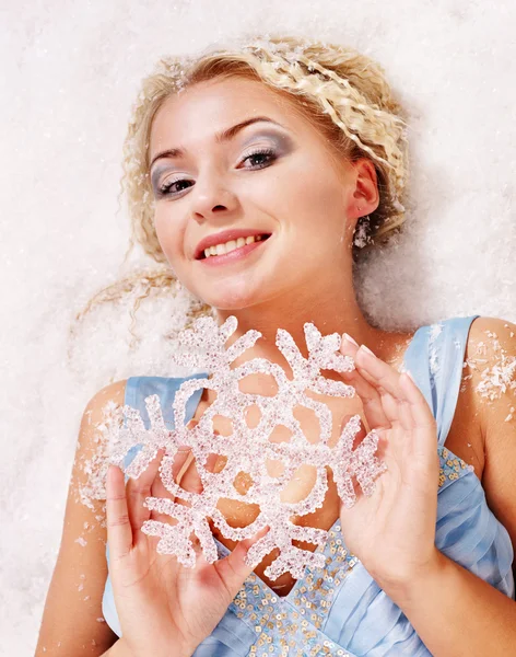 Young woman holding snowflake. — Stock Photo, Image
