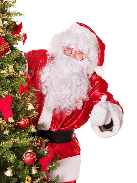 Weihnachtsmann am Weihnachtsbaum Daumen hoch. — Stockfoto