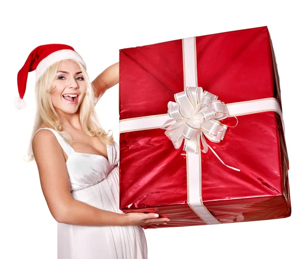 Різдвяна дівчина в капелюсі Санта тримає червону подарункову коробку . — стокове фото