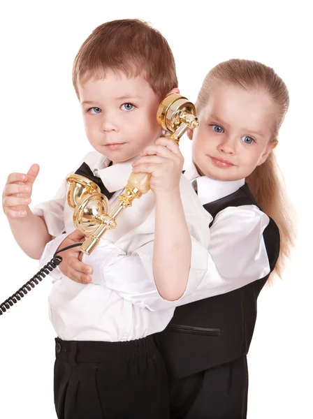 Kinderen in pak met telefoon. — Stockfoto