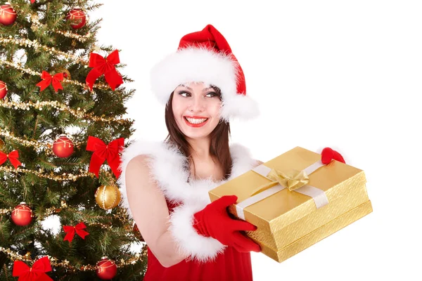 Girl in santa hat giving gift box. Stock Photo