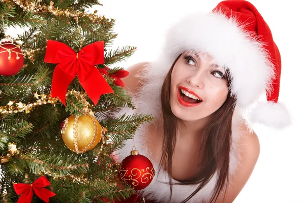 Christmas girl in santa hat holding stack gift box. Royalty Free Stock Images