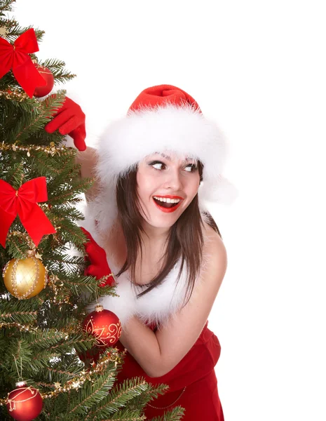 Christmas girl in santa hat with fir tree. Stock Photo