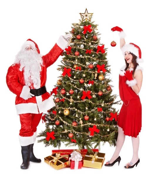 Weihnachtsmann und Mädchen am Weihnachtsbaum . lizenzfreie Stockbilder