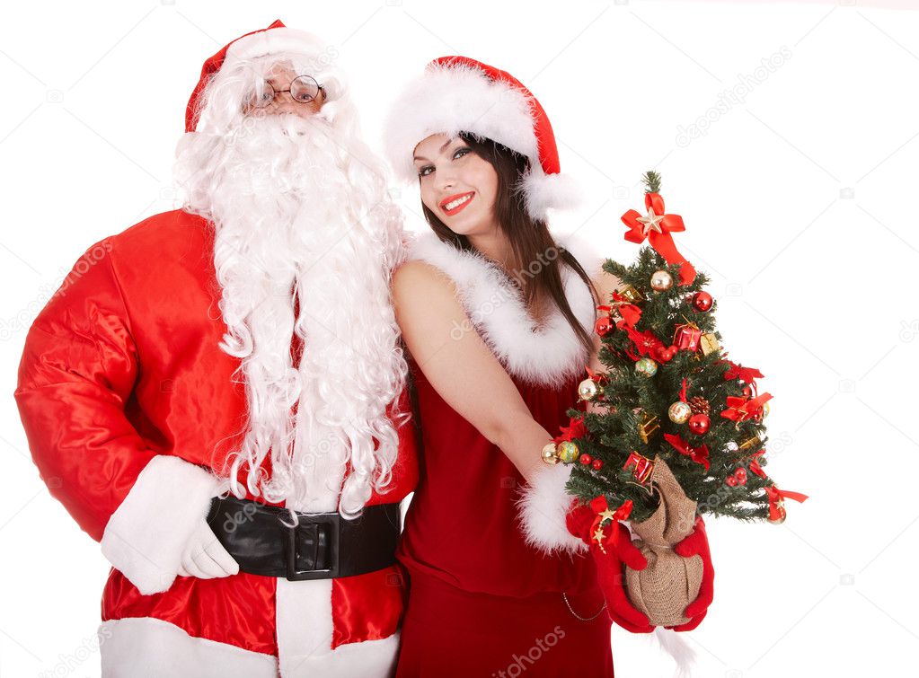 Santa clause and christmas girl with tree.