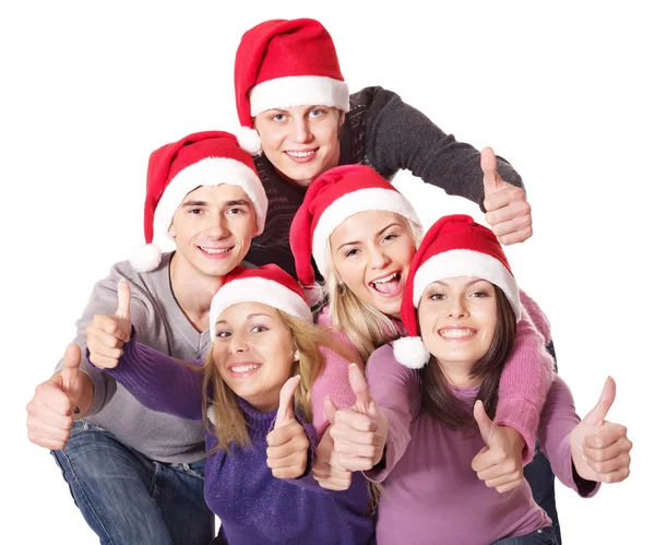 Groep jonge in Kerstman hoed . — Stockfoto