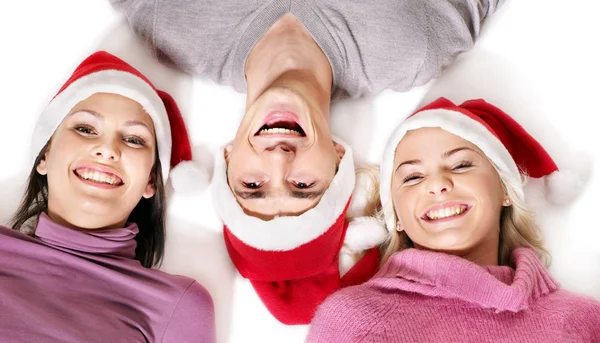 Mädchen mit Weihnachtsmütze liegen Kopf an Kopf. — Stockfoto