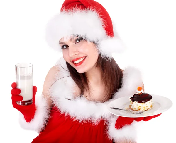 Menina em vermelho santa chapéu comer bolo no prato . — Fotografia de Stock