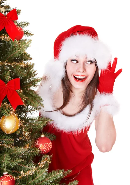 Noel Baba şapkalı kız Noel ağacının yanında dinle. — Stok fotoğraf