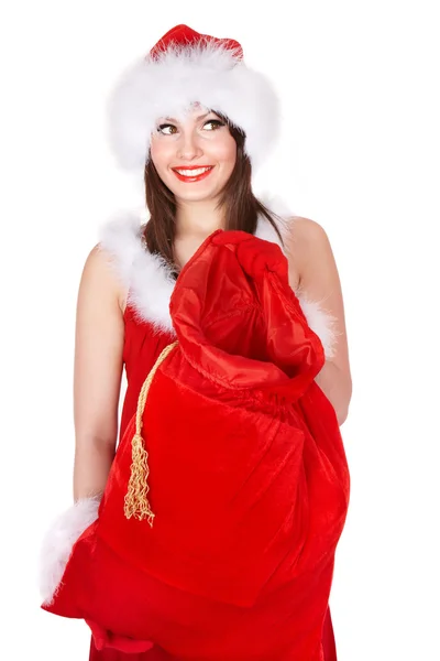 Christmas girl in Santa hat with bag of present. — Stock Photo, Image