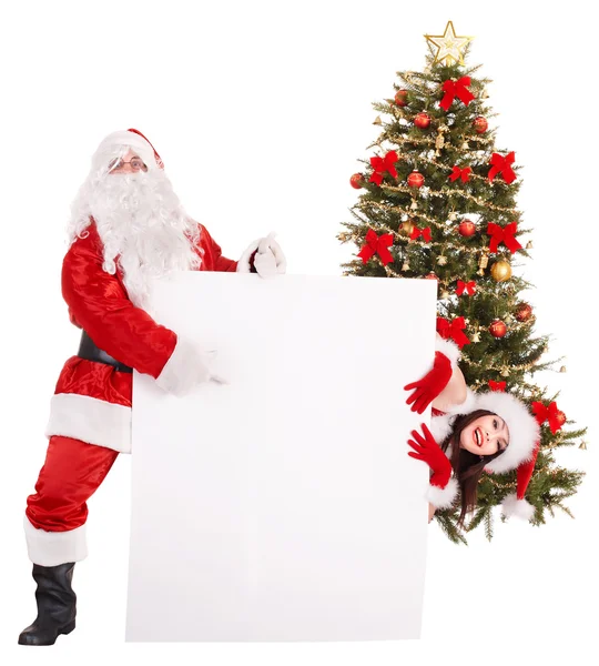 Santa Claus y niña sosteniendo pancarta por árbol de Navidad .. — Foto de Stock