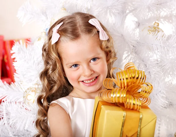 Kid with Christmas gift box. Stock Image