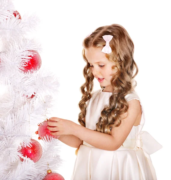 Child decorate Christmas tree. Stock Photo
