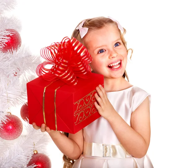 Kid with red Christmas gift box. Stock Photo