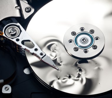 Interior of damaged hard drive clipart