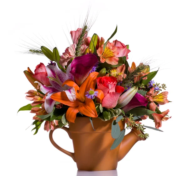 Bouquet of flowers in watering can — Stock Photo, Image
