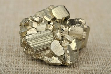 Pyrite in the background of a burlap clipart
