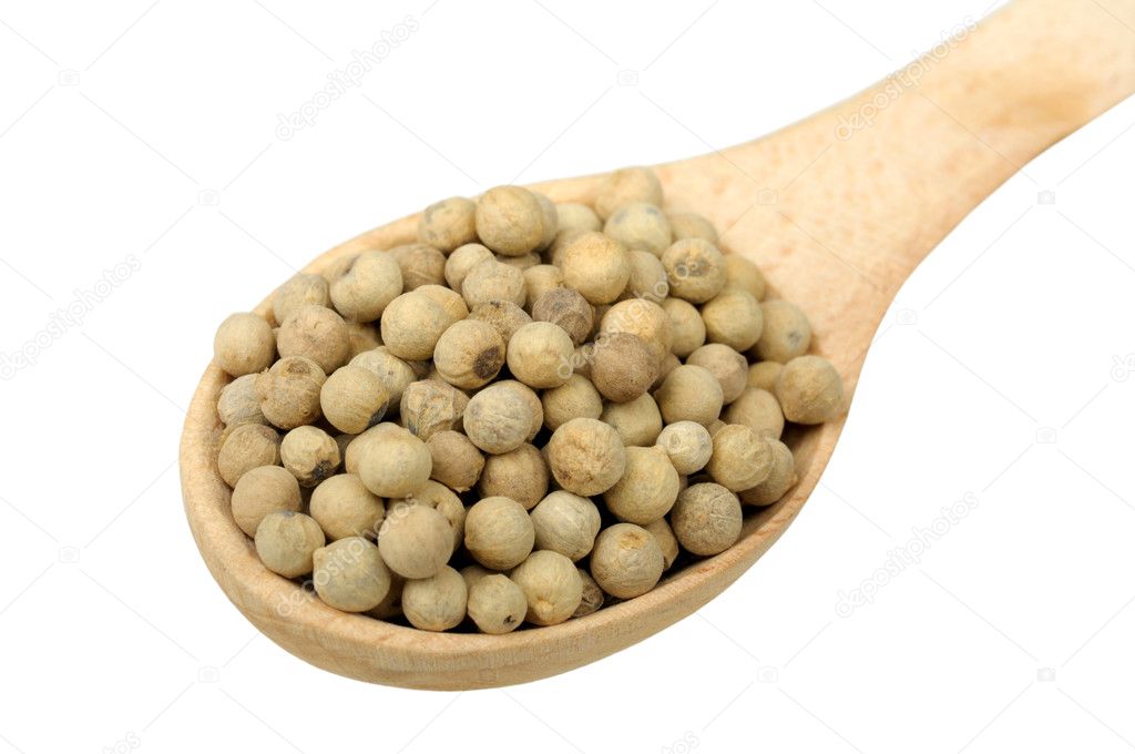 White pepper in a wooden spoon