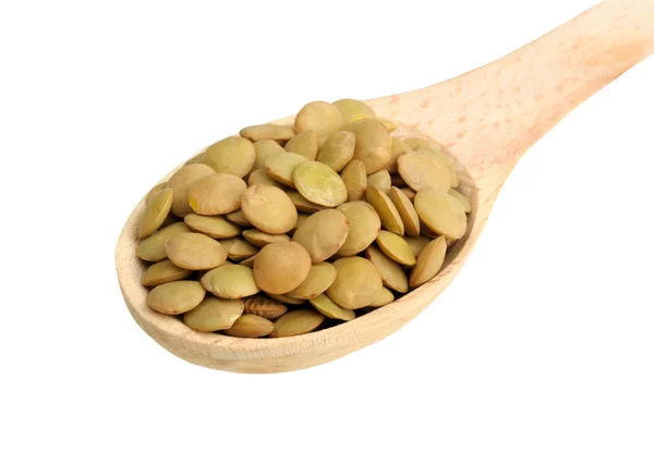 Lentils in wooden spoon — Stock Photo, Image