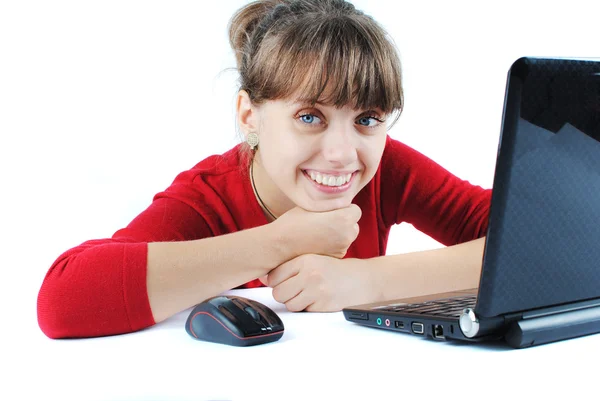 Young woman sitting at desk — Stock Photo, Image