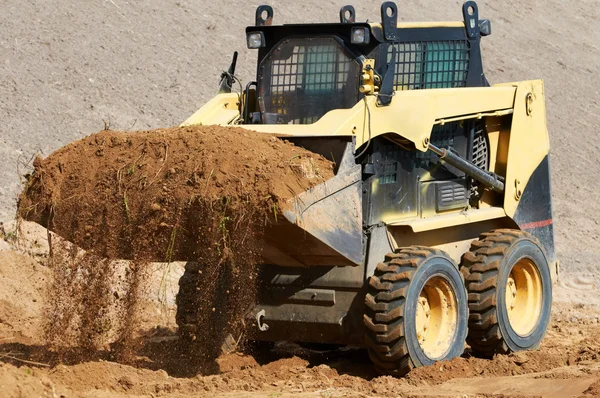 stock image Skid steer loader at earth moving works