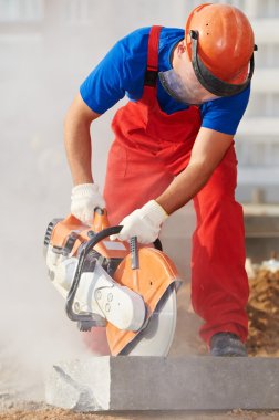 Builder at cutting curb work clipart