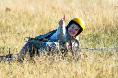 Parachute jumper after landing clipart