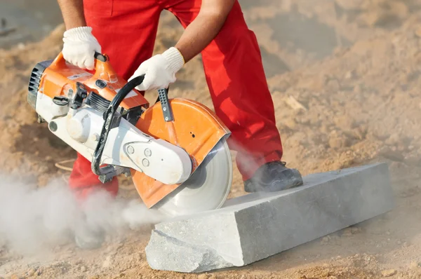 stock image Builder at cutting curb work