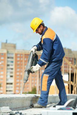 Portrait of construction worker with perforator clipart