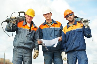 Construction workers with power tools clipart