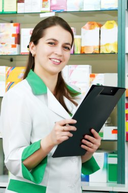 Pharmacy chemist woman in drugstore clipart