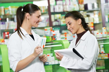 Pharmacy chemist women in drugstore clipart