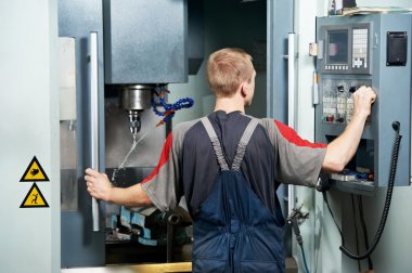 Worker at machining tool workshop clipart