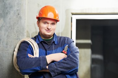 Portrait of young Electrician in uniform clipart