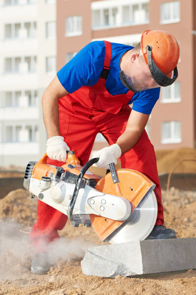 Builder at cutting curb work