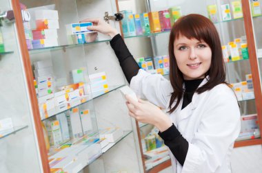 Pharmacy chemist woman in drugstore clipart