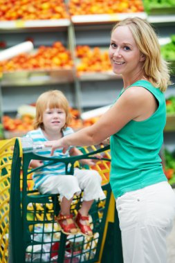 Woman and boy making shopping clipart