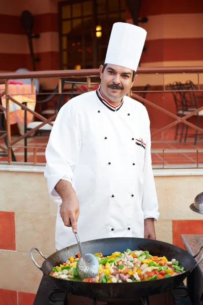 stock image Arab chef frying meat on pan